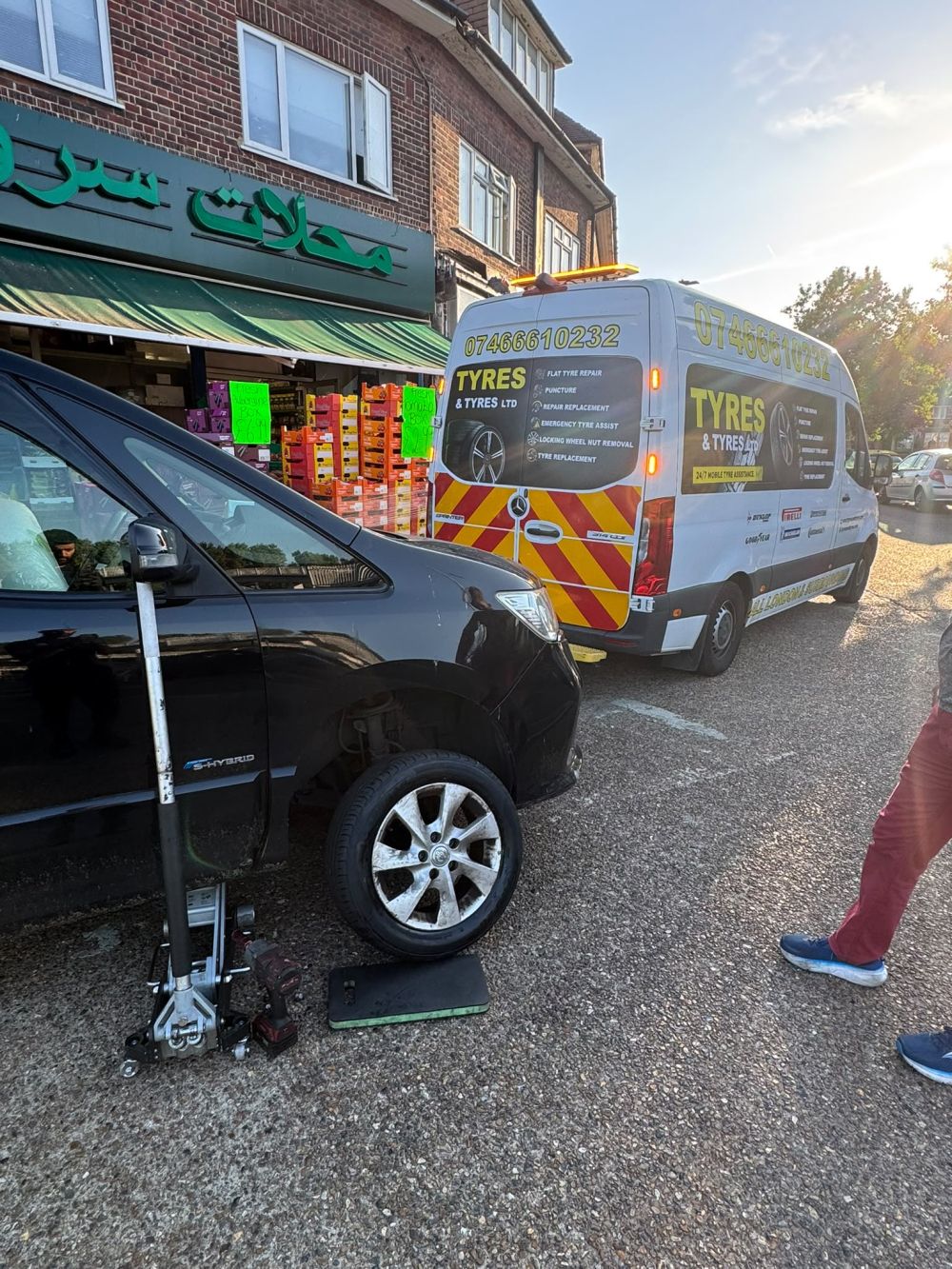 Mobile tyre technician performing 24/7 emergency tyre fitting on location in London