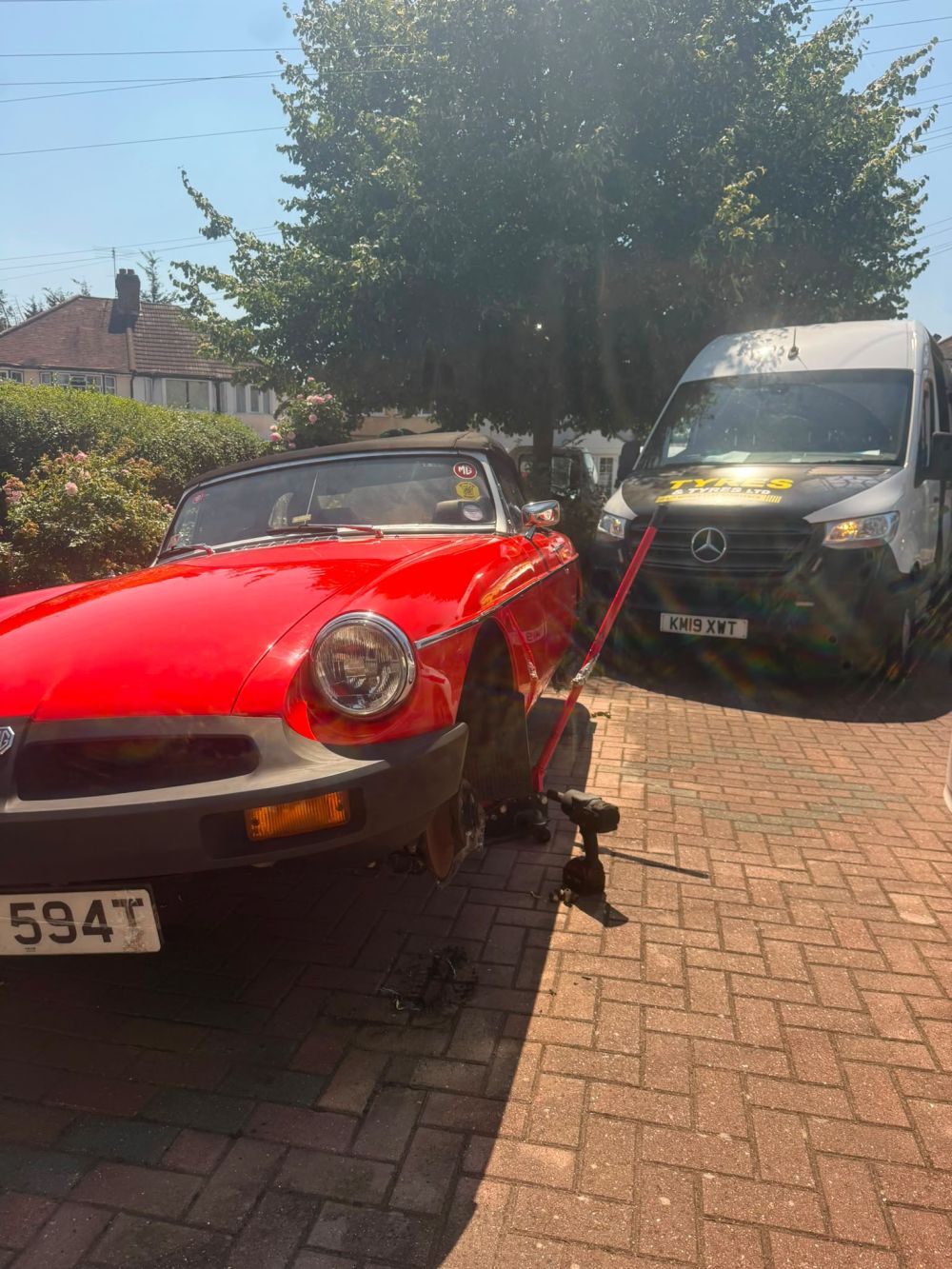 Mobile tyre technician performing 24/7 emergency tyre fitting on location in London
